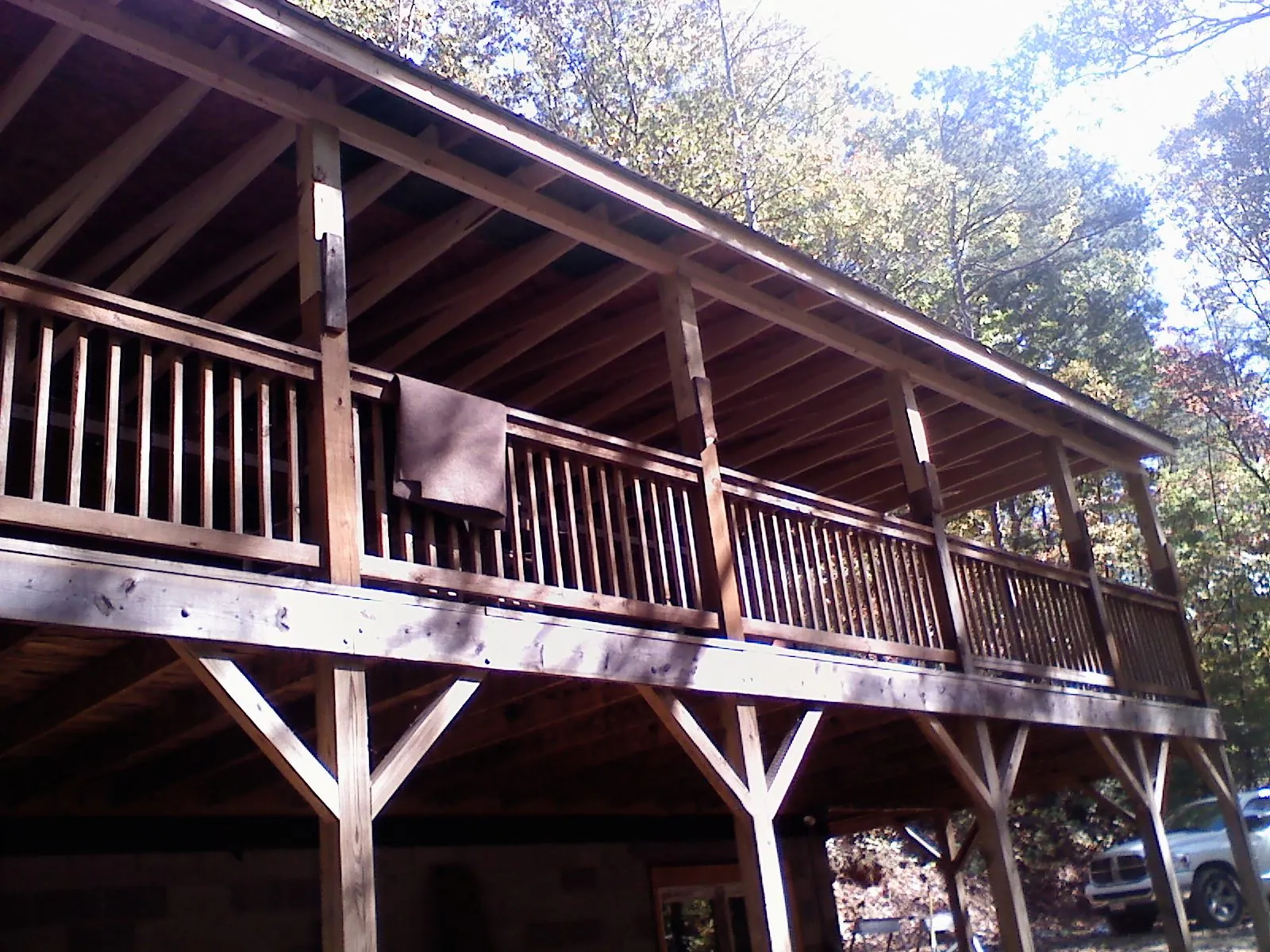 Timber framing under a new elevated porch and deck in Van Hornesville